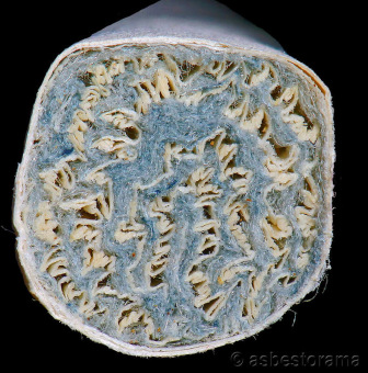 Close-up detail of a 1952 Kent Micronite filter cigarette, showing the mouthpiece end with fibrous tufts of tiny crocidolite fibers.