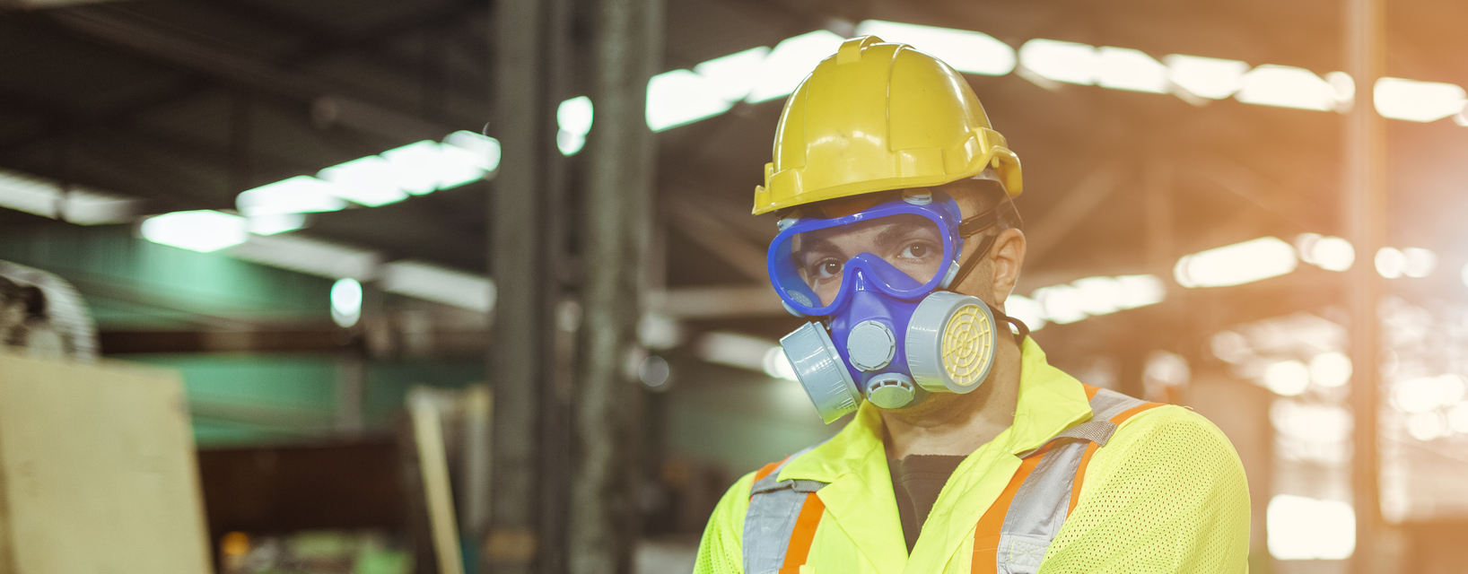 Worker wearing safety uniform gas mask for dangerous area, prevention chemical and virus.