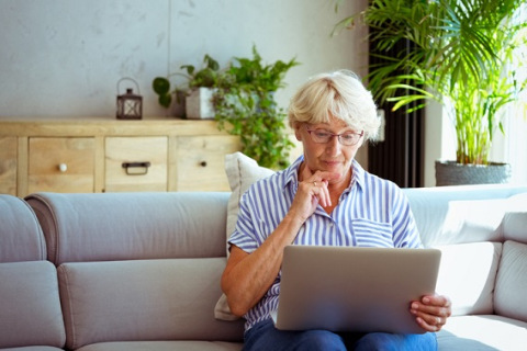 Woman using laptop at home