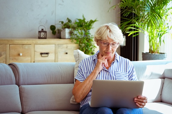 Woman using laptop at home