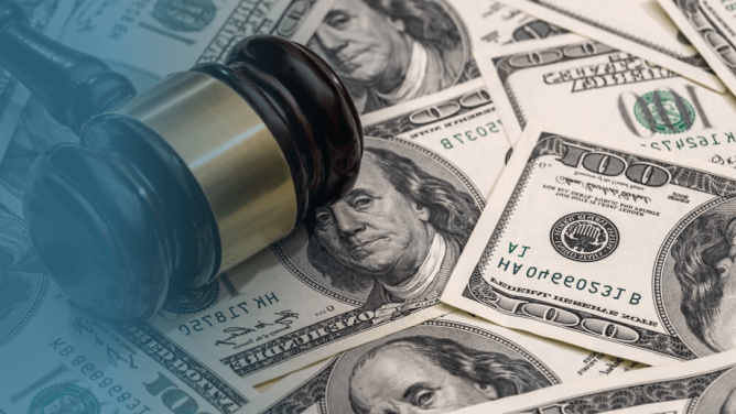 gavel on top of a pile of money