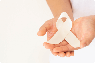 Hands holding up a mesothelioma awareness ribbon